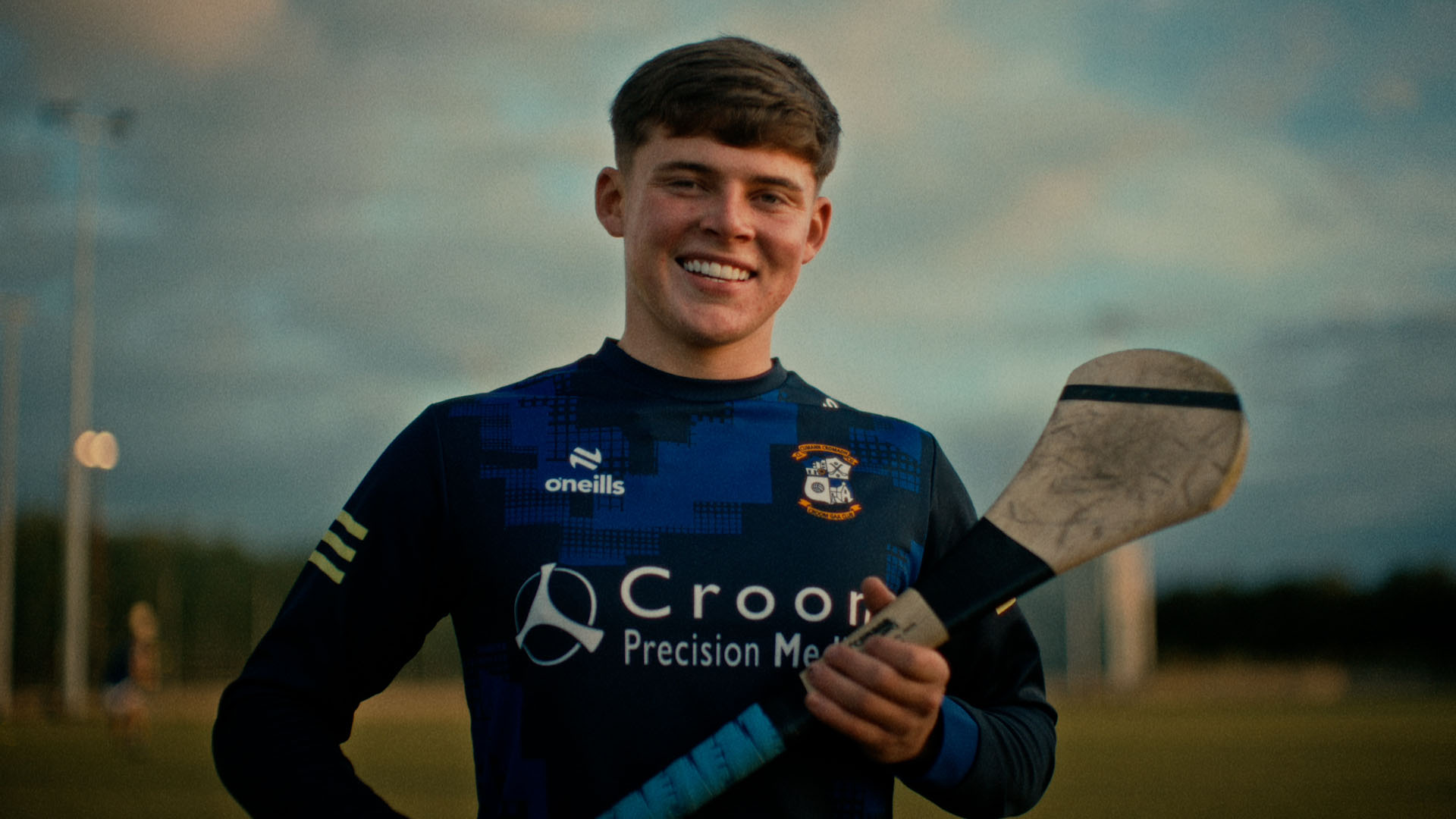 Man on Croom hurling team holding a hurl