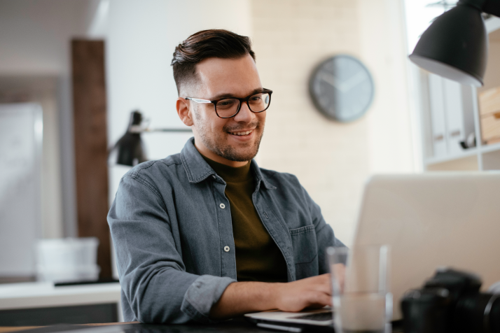 Person smiling at desktop